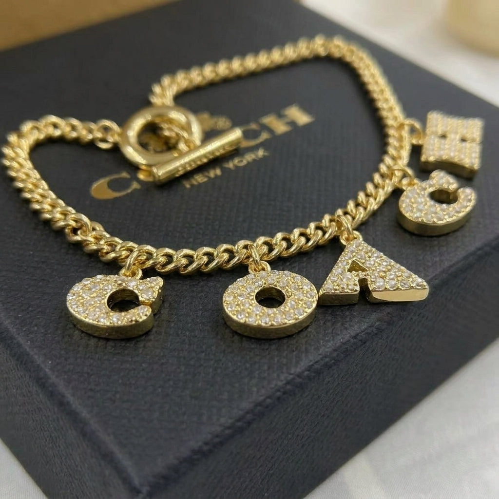COACH Station  Pave Coach Charm bracelet