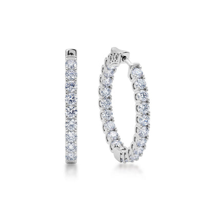Inside-out round cut lab grown diamond hoop earrings in sterling silver isolated on white background