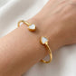 Model wearing Kate Spade New Classic Heart Gold Bracelet for an effortless luxury style
