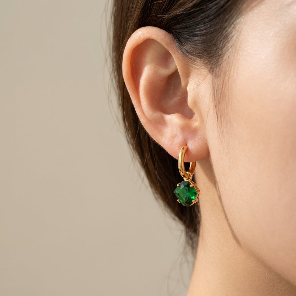 Model wearing Kate Spade New York Key Earrings, showcasing a chic and playful jewelry look