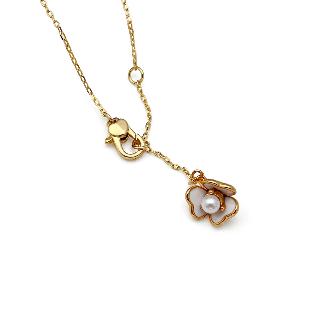 Detailed shot of the lobster clasp and signature Kate Spade heart or spade charm on the extender
