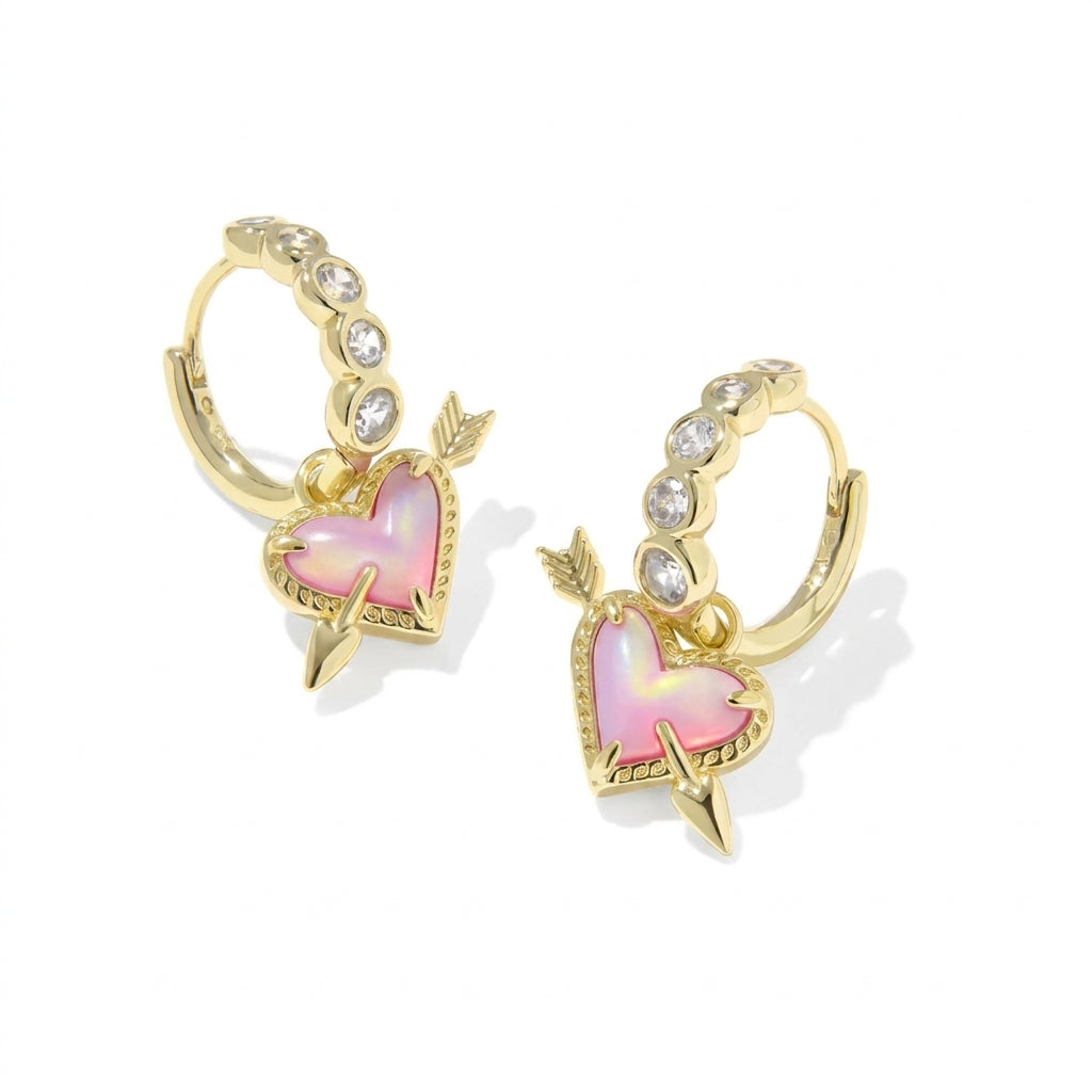 Kendra Scott Ari Heart Arrow gold convertible huggie earrings with pavé crystals and pink heart charm.