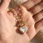 Hand-held size reference of the Ari Heart Pearl Necklace to show the delicate pendant scale