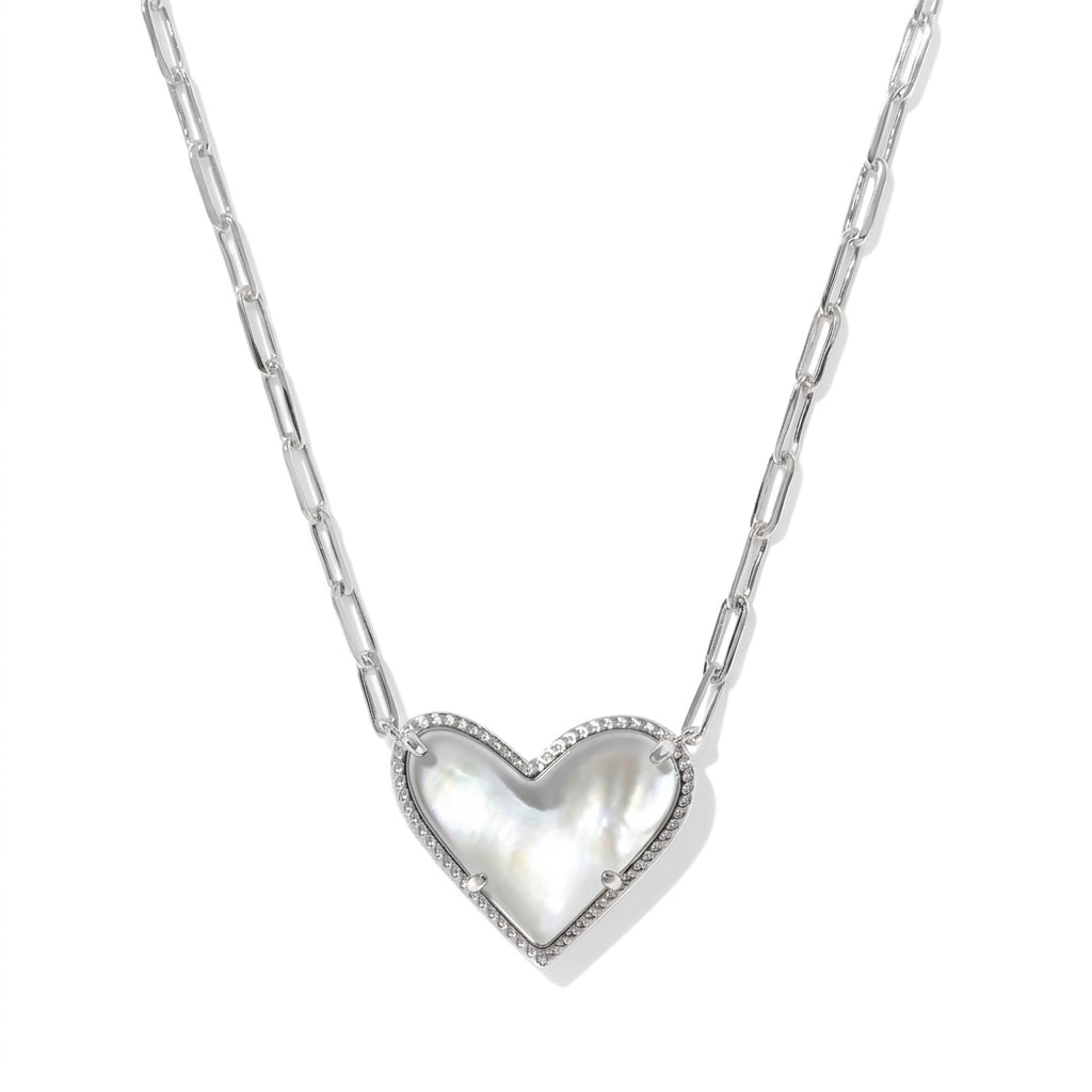 The Kendra Scott Ari asymmetric heart silver curb chain necklace featuring a white mother of pearl pendant.