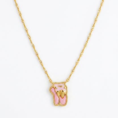 Kendra Scott Ballet short pendant necklace in gold featuring pink enamel ballet slippers charm.