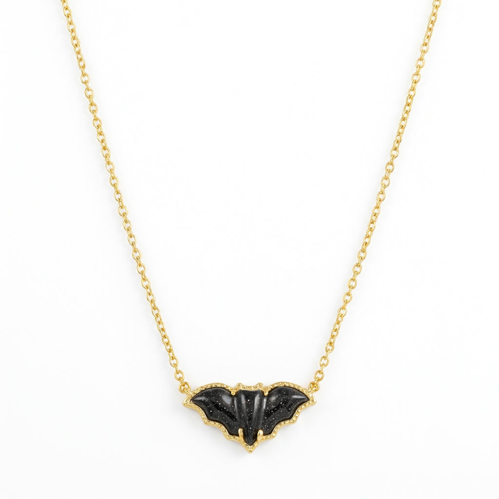 Kendra Scott Bat short pendant necklace in 14k gold plated brass, featuring a black golden obsidian stone framed by hoofprint detailing.