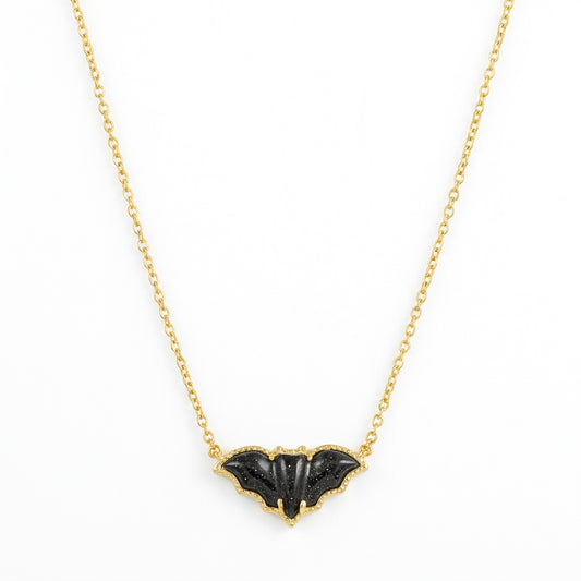 Kendra Scott Bat short pendant necklace in 14k gold plated brass, featuring a black golden obsidian stone framed by hoofprint detailing.