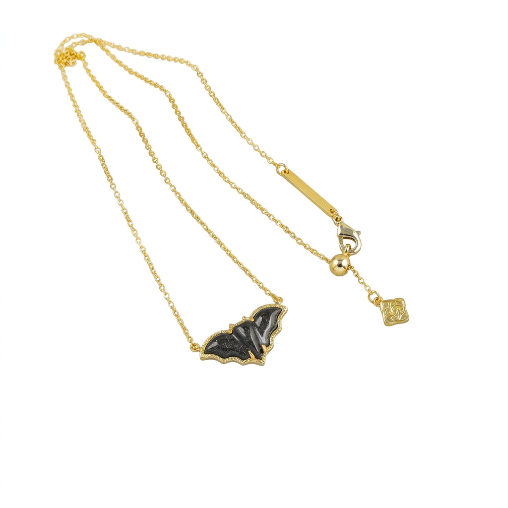 Detailed view of the Kendra Scott bat necklace back, showing the lobster clasp and adjustable single slider bead chain.