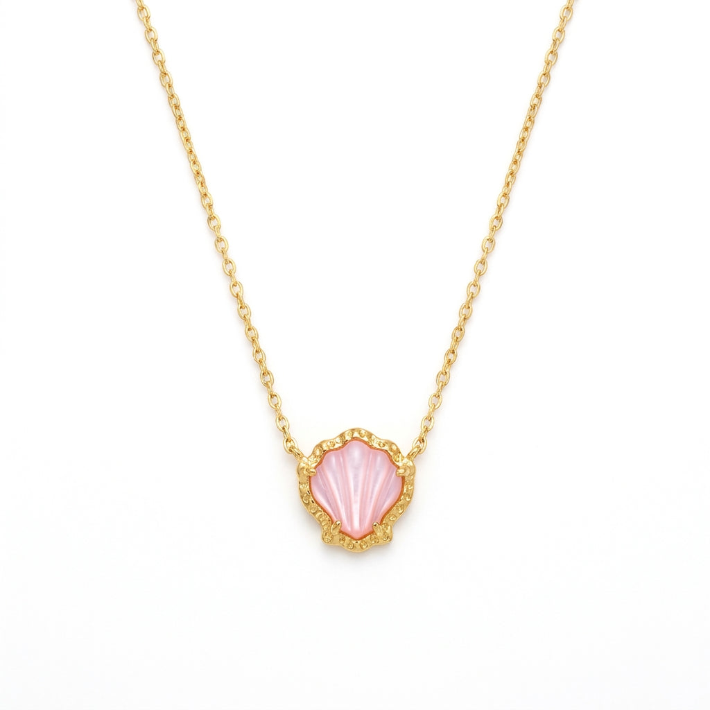Kendra Scott Brynne Shell gold pendant necklace featuring a vibrant pink scalloped stone.