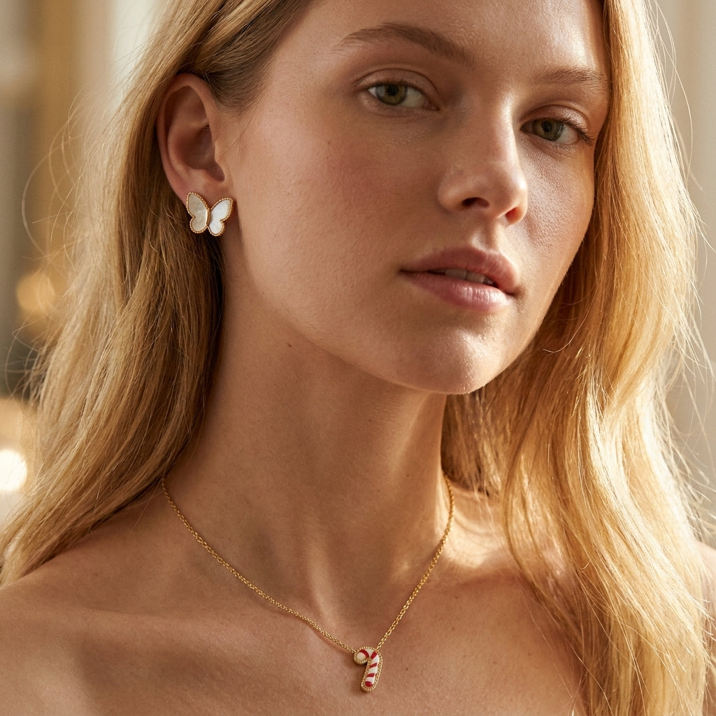 Model turns and smiles wearing Kendra Scott Candy Cane Necklace, capturing the festive shimmer