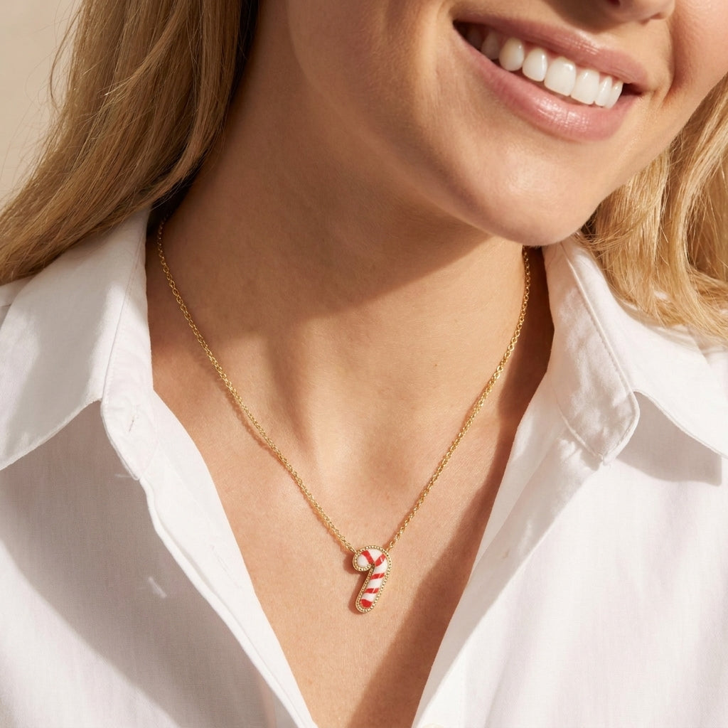 Model wearing Kendra Scott Candy Cane Necklace, a playful yet elegant holiday jewelry piece