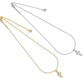 Two Kendra Scott cross pendant necklaces displayed together in yellow gold and silver options