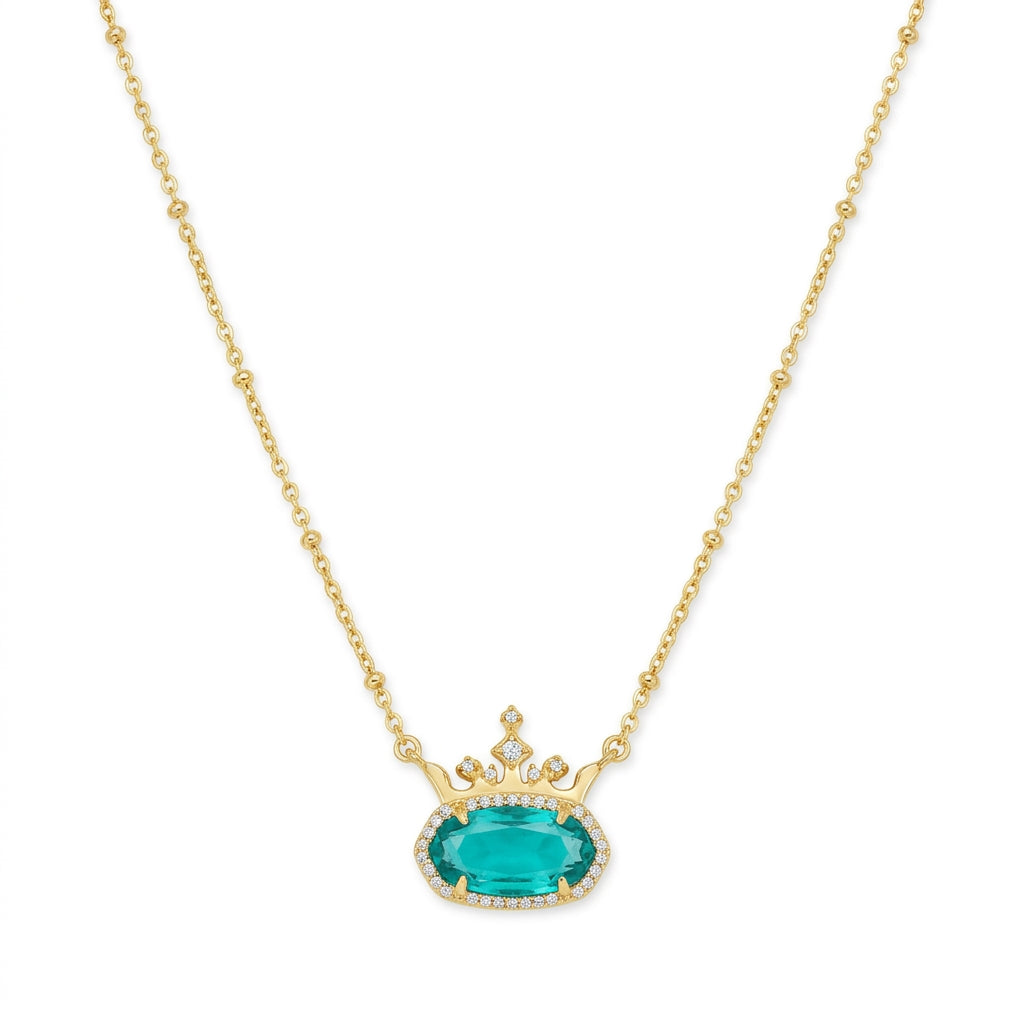 Kendra Scott x Disney Elisa Princess gold crown necklace featuring an emerald green teal stone.