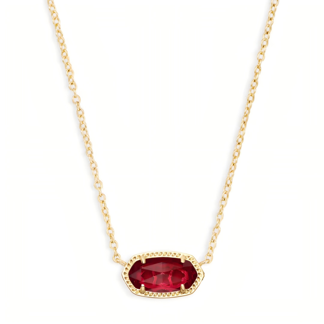 Kendra Scott Elisa gold pendant necklace with a brilliant faceted ruby red gemstone.
