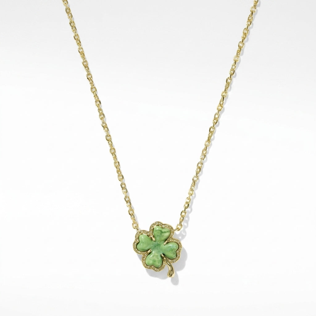 Kendra Scott four-leaf clover gold short pendant necklace with a lucky green aventurine stone on a delicate chain