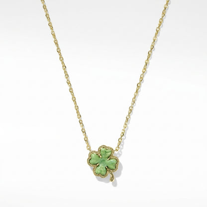 Kendra Scott four-leaf clover gold short pendant necklace with a lucky green aventurine stone on a delicate chain