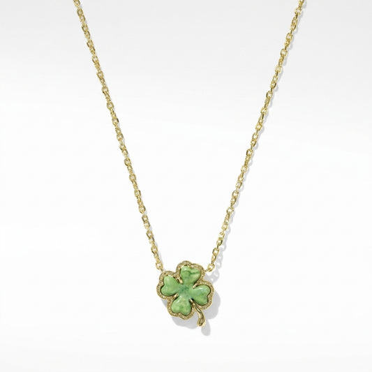Kendra Scott four-leaf clover gold short pendant necklace with a lucky green aventurine stone on a delicate chain