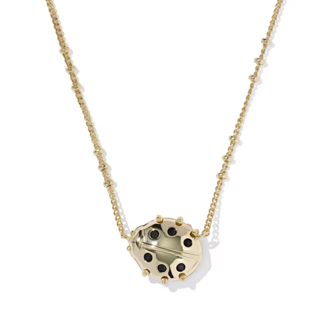 Kendra Scott gold ladybug necklace angle view showing petite charm shape
