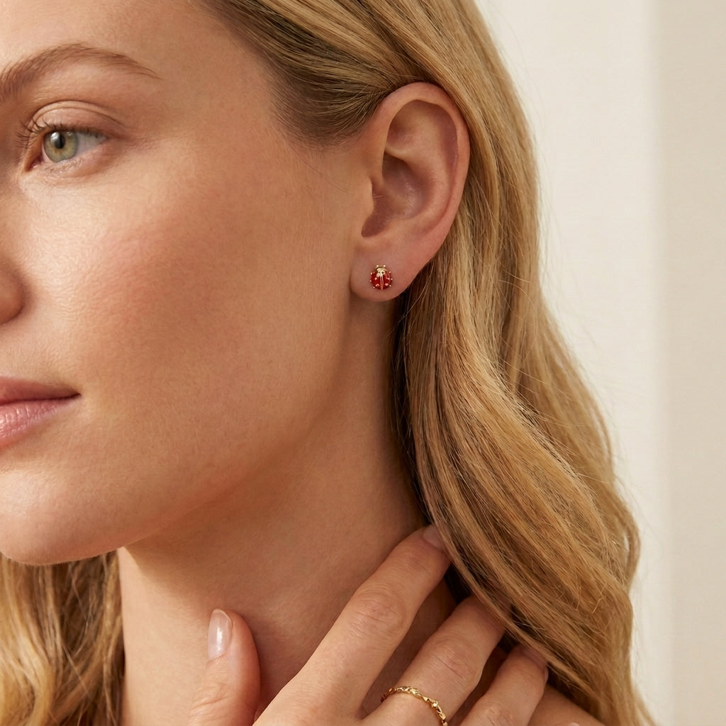 Model wearing Kendra Scott Gold Ladybug Earrings, an elegant minimalist daily accessory