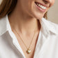 Model wearing Kendra Scott Bold Heart Locket Pendant, a timeless statement piece
