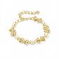 Kendra Scott x LoveShackFancy gold bow bracelet angle view showing delicate bow shape