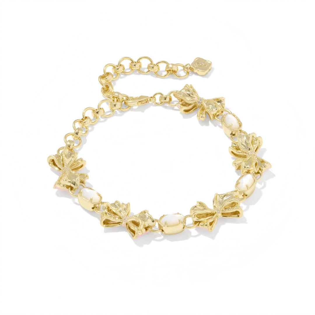 Kendra Scott x LoveShackFancy gold bow bracelet angle view showing delicate bow shape