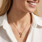 Model turns and smiles wearing multicolor Candy Cane Necklace, capturing the colorful shimmer