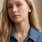 Model wearing Kendra Scott Multicolor Candy Cane Necklace, a vibrant accessory for holiday styling