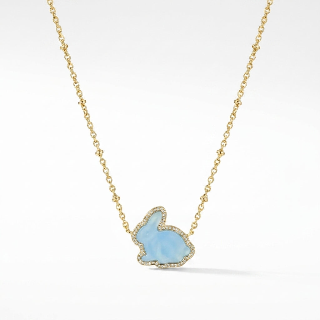 Kendra Scott Rabbit short pendant necklace in gold with a light blue dyed magnesite stone.