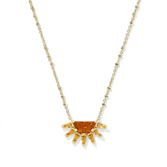 Kendra Scott Samantha Sun short pendant necklace in gold with an orange glass mosaic sunburst charm.