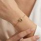 Model wearing Kendra Scott Bold Heart Vermeil Bracelet, a timeless luxury statement piece