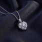Lab grown diamond quilted lattice heart pendant resting on dark silk fabric.