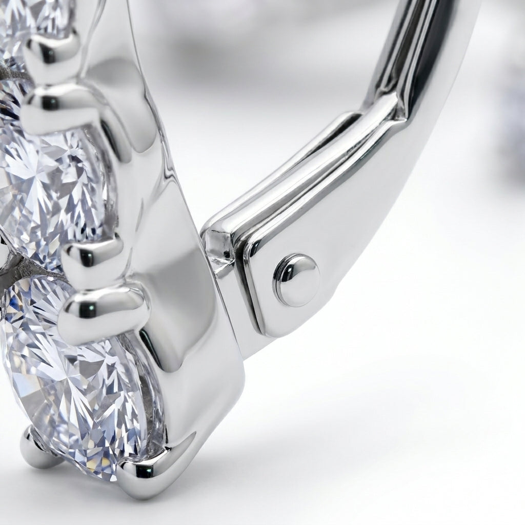 Close-up view of secure leverback closure mechanism and prong settings.