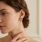 Model wearing Loewe Enamel Anagram Studs, a sophisticated minimalist accessory