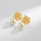 Loewe Anagram Geometric Pearl gold Earrings featuring an openwork logo and natural pearl drop