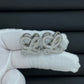 Hand-held size reference of the Loewe Anagram Geometric Earrings for true scale