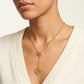 Model wearing LOEWE gold OT Necklace, a sophisticated statement piece for modern luxury