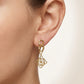 Close-up shot of the Loewe Anagram Pendant Earrings on earlobe, highlighting the high-shine finish