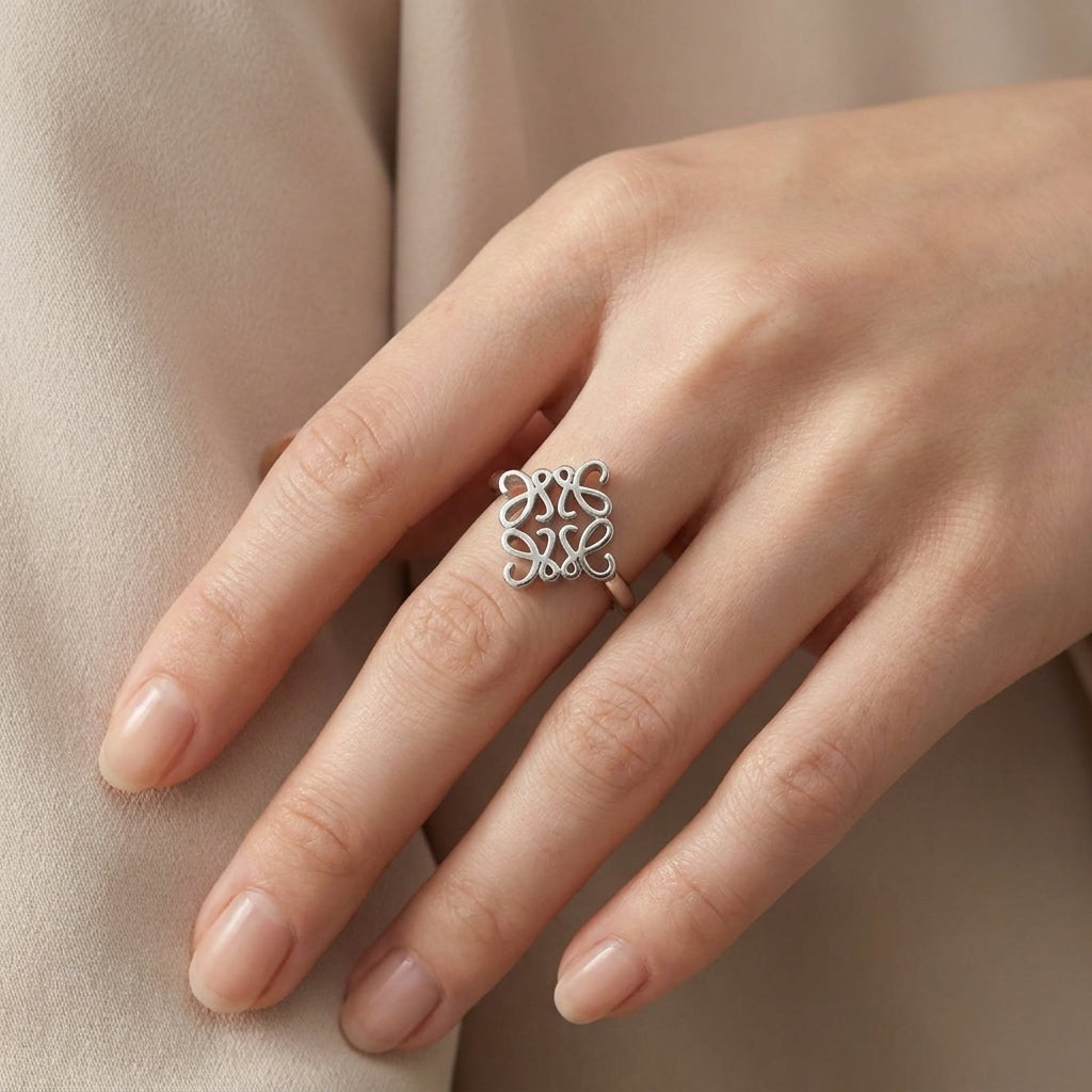 Model wearing Loewe Silver Anagram Ring, a chic minimalist statement piece for daily luxury
