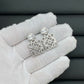 Hand-held size reference of the Loewe Cutout Crystal Earrings to show the luxurious scale