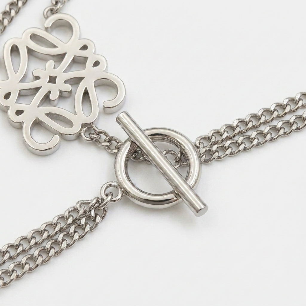 Detailed shot of the secure clasp and the discreet Loewe logo hallmark on the silver bracelet