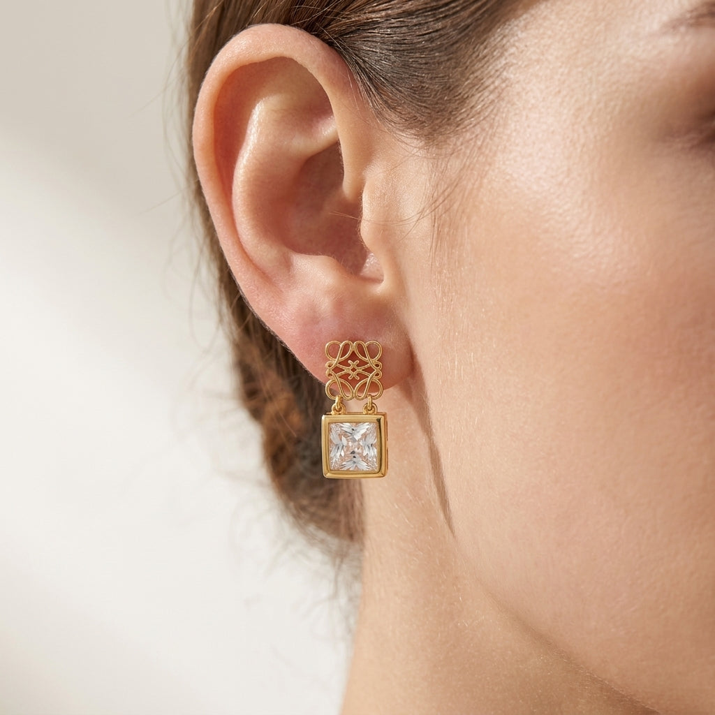 Model wearing Loewe Gold Monogram Earrings, a chic minimalist accessory for luxury daily styling