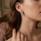 Model wearing Loewe Square Full-Pavé Earrings, a bold minimalist statement for daily luxury