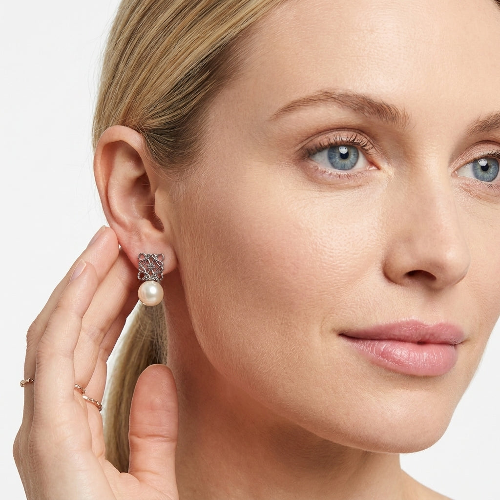 Side view of model wearing Loewe Geometric Pearl Earrings, an elegant daily luxury accessory