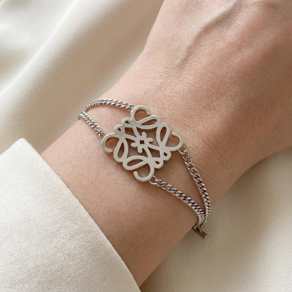 Model wearing Loewe Silver Anagram Bracelet, a bold and minimalist accessory for modern luxury