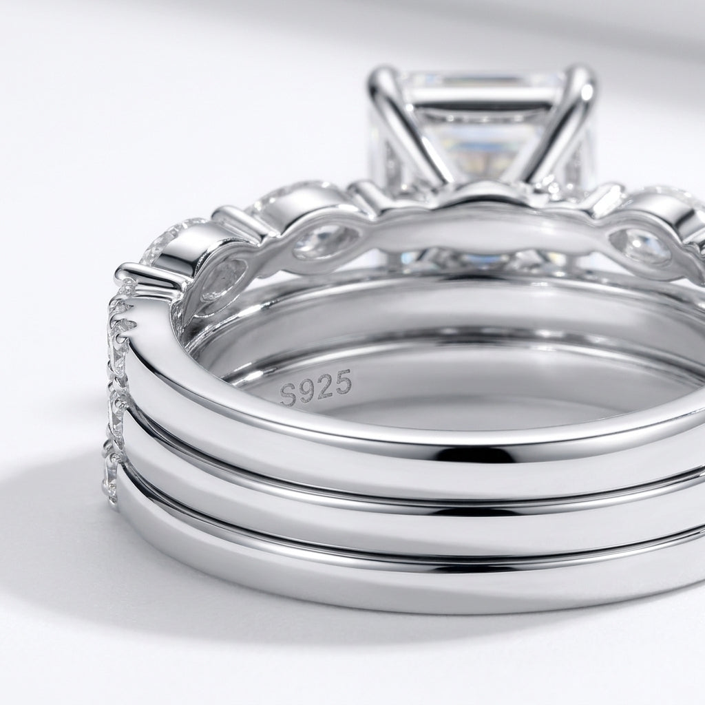 Micro profile view showing the sterling silver bands, S925 hallmark, and precise prongs of luxury emerald cut moissanite stackable rings.