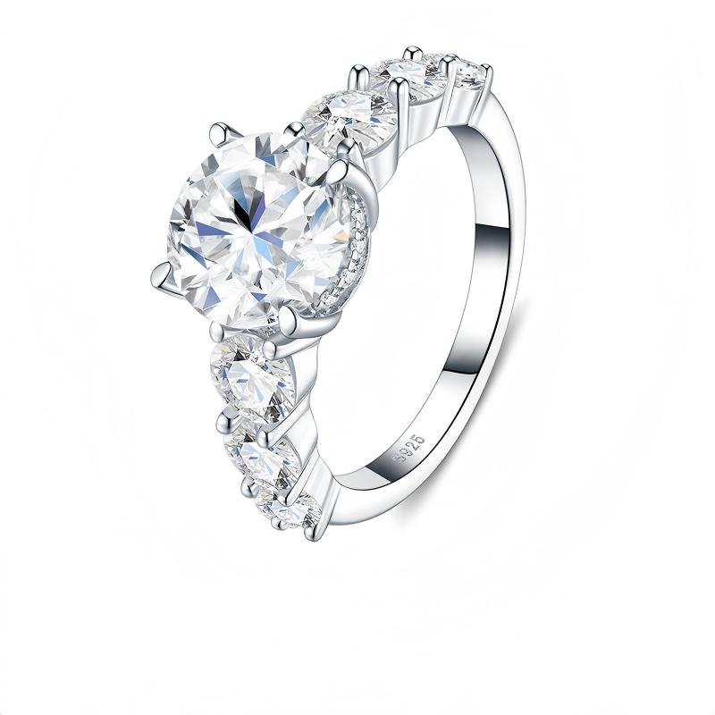 Three-quarter studio perspective of a luxury graduated side stone brilliant cut proposal ring with intricate gallery detail.