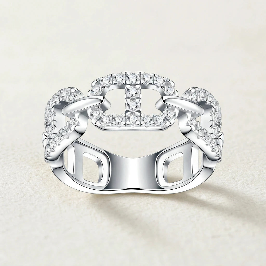 Front studio display of luxury mariner chain gemstone eternity band showing precise pave setting and smooth silver finish.