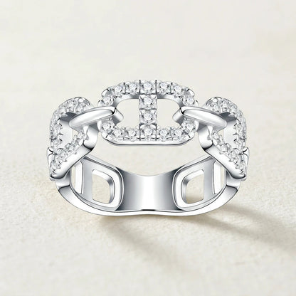 Front studio display of luxury mariner chain gemstone eternity band showing precise pave setting and smooth silver finish.