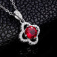 Luxury round-cut ruby hollow four-leaf clover pendant necklace displayed on a textured black leather surface.